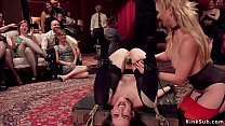 MILF senior slave Cherie Deville teaching young sexy brunette slave Mystica Jade anal fuck in pile driver bondage for audience at bdsm party